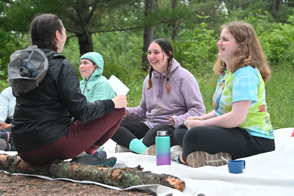 Students and staff on at campsite