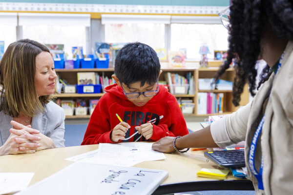 teachers helping student