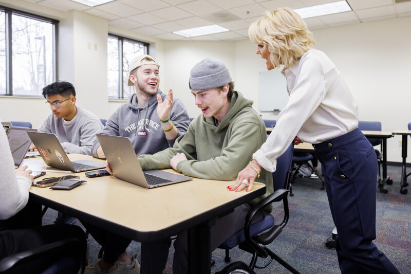 teacher helping student