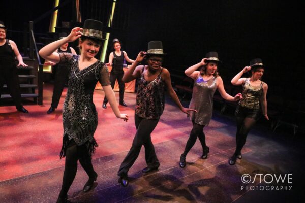 a group of women dancing on a stage