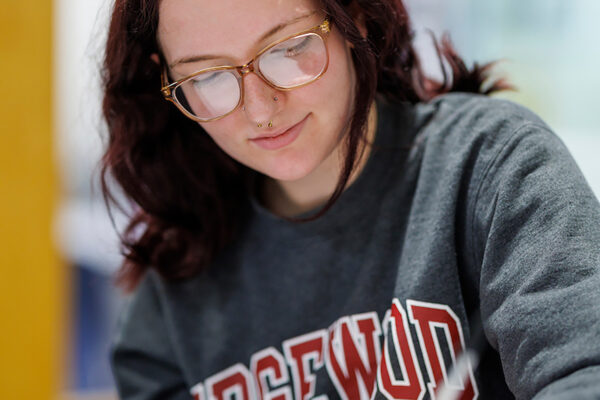 a person writing on a paper