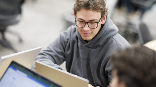 student looking at laptop screen