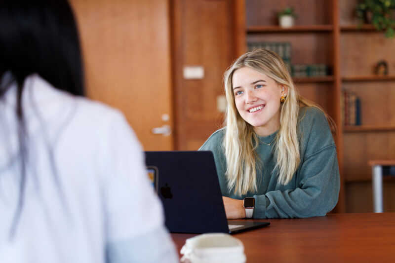Student talking to another student