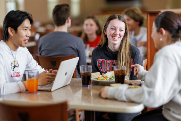 a group of people sitting at a table