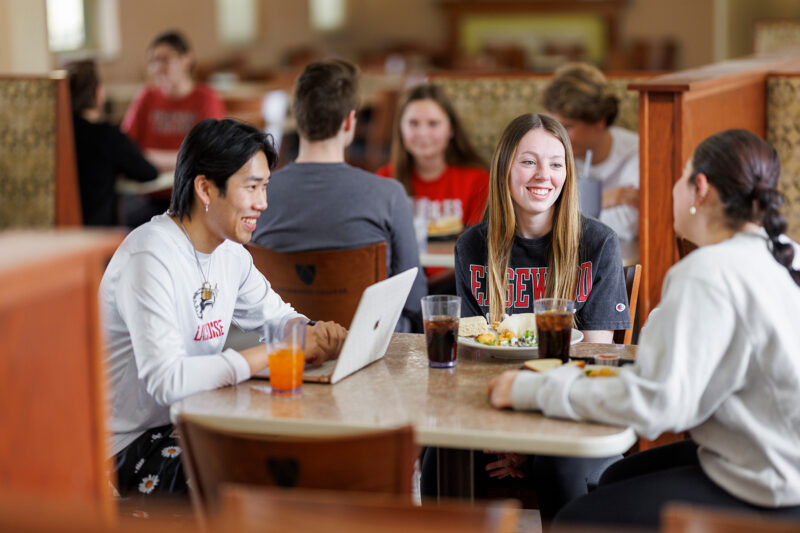 a group of people sitting at a table