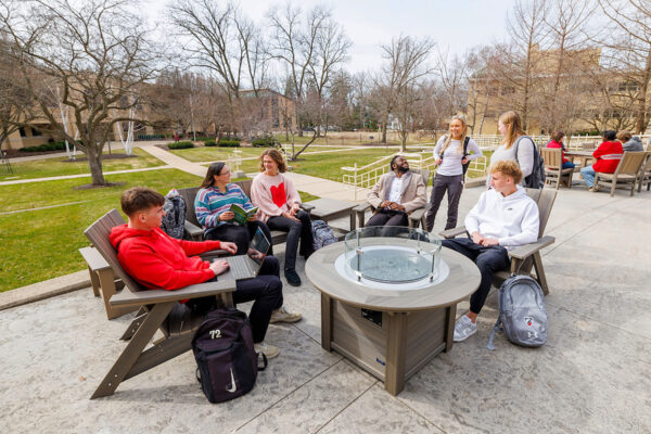 a group of people sitting around a table