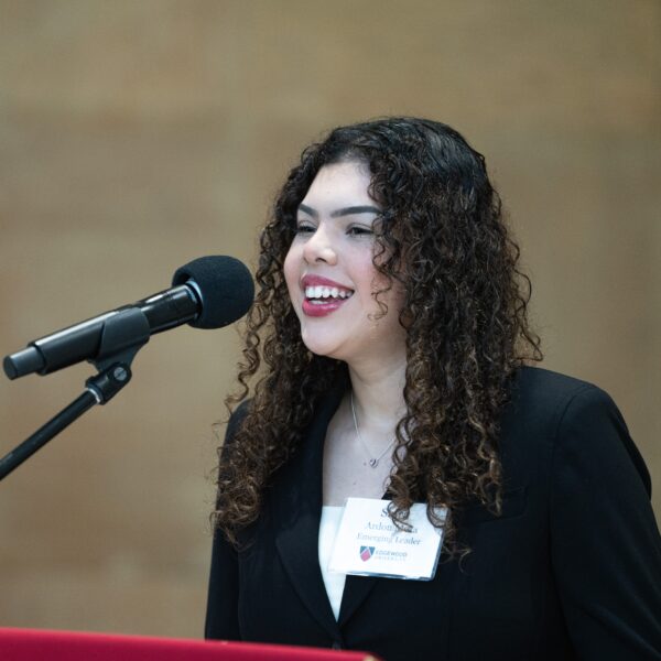 Saira Ardon Meza speaking into microphone