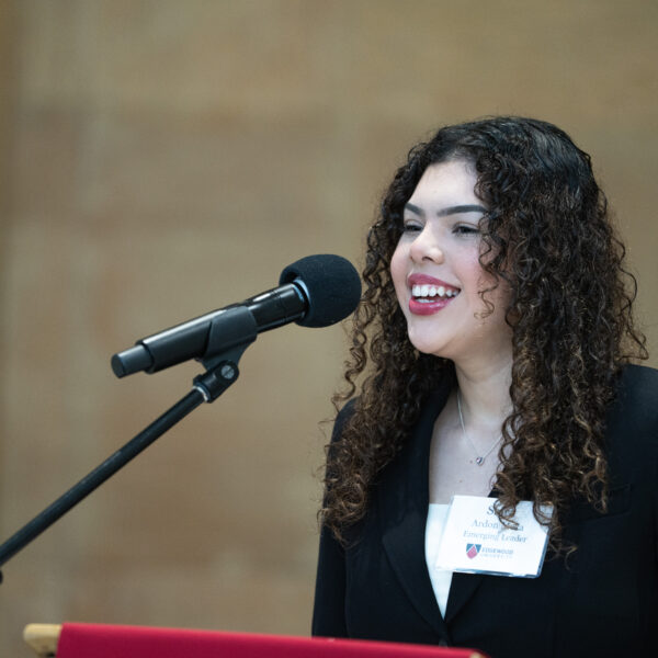 woman speaking into microphone