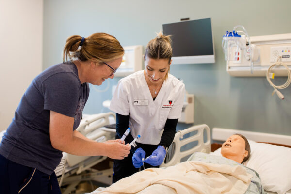 a teacher teaching a student