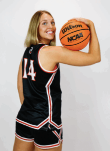 Woman posing with basketball