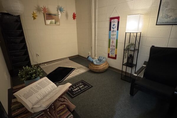 a room with a few chairs and a table