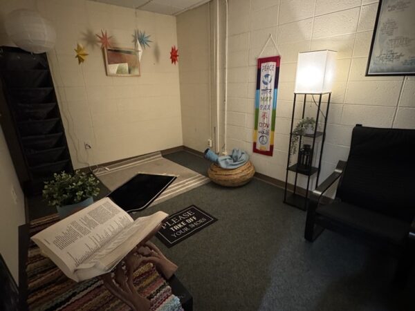 a room with a few chairs and a table