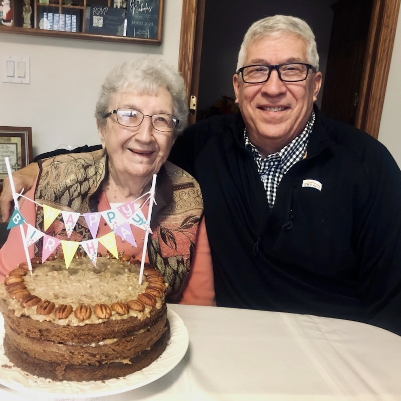 mom and son celebrating with cake