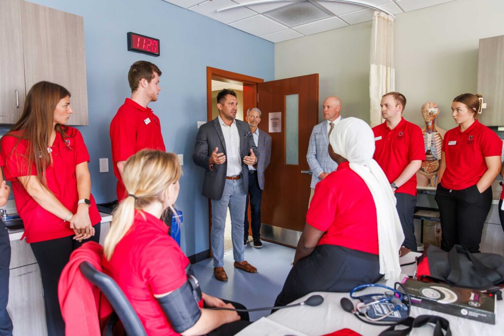 Chad Weis, Home Instead, speaks with Nursing students during a recent visit to Edgewood University.