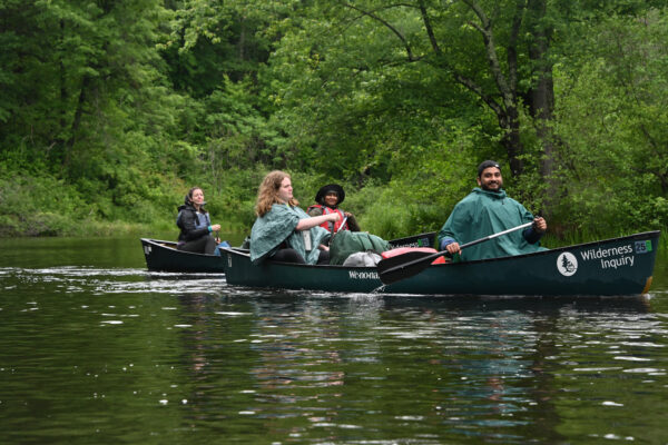 people in canoes
