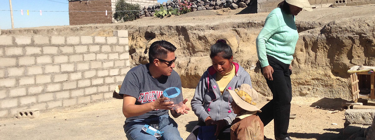 Javier with children in Peru